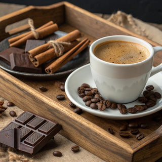 Cup of coffee with chocolate and cinnamon on a wooden tray coffee